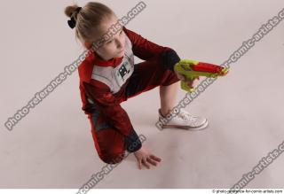 DENISA SITTING POSE WITH GUN